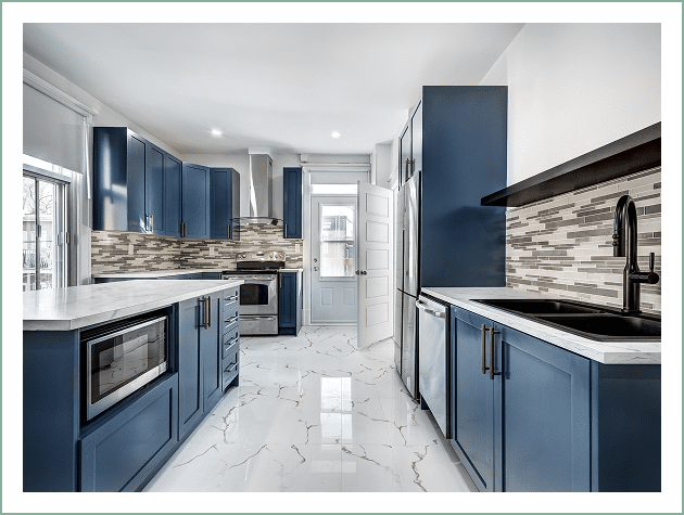 Modern kitchen with blue cabinets and appliances.